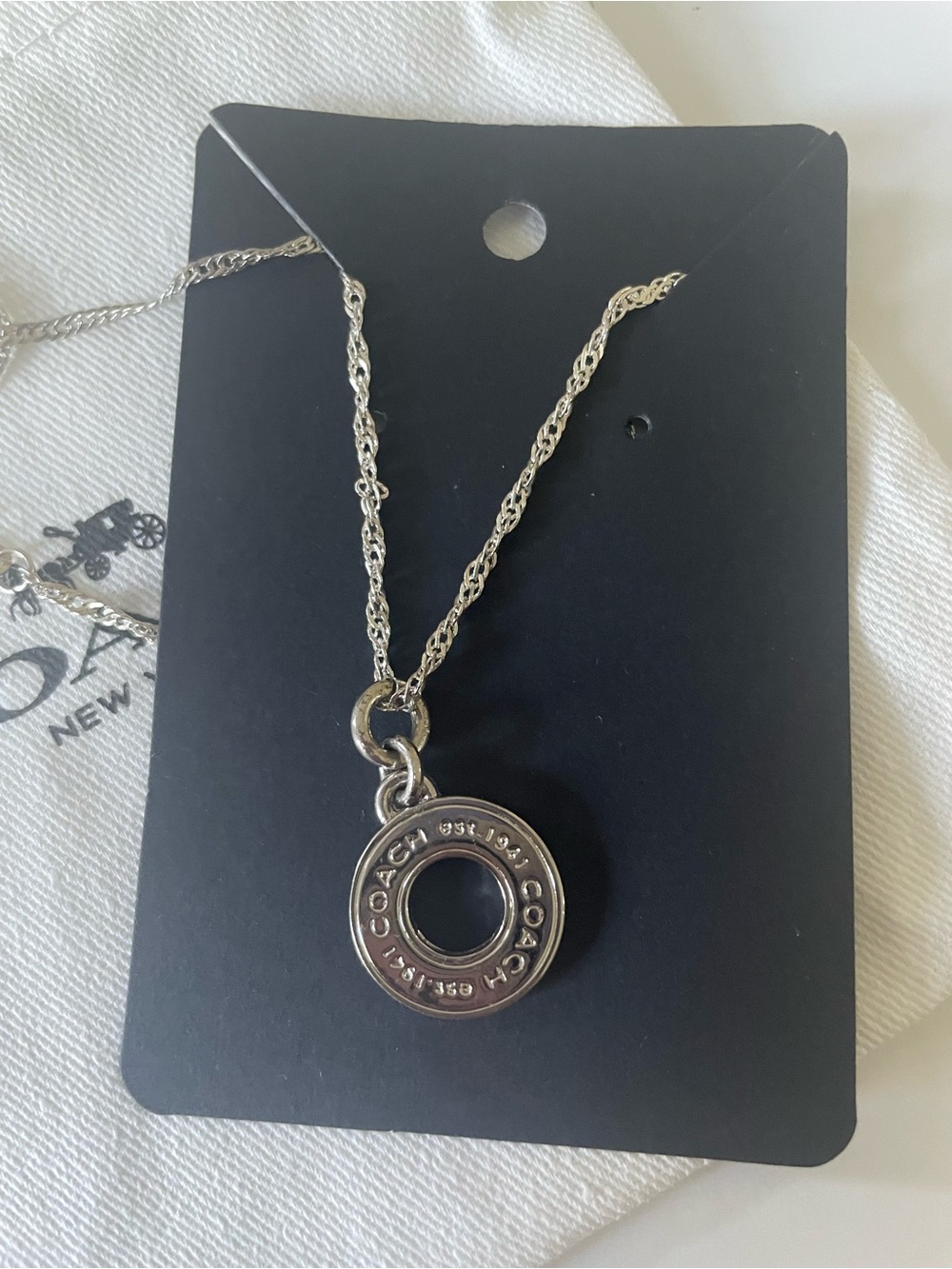Coach Silver-Tone Circular Logo Pendant Necklace